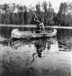 4. An Ojibwe Native American spearfishing in Minnesota in 1908