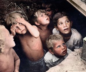 Children in Minsk, Belorussia watching as their neighborhood is bombed in June, 1941 COLOR