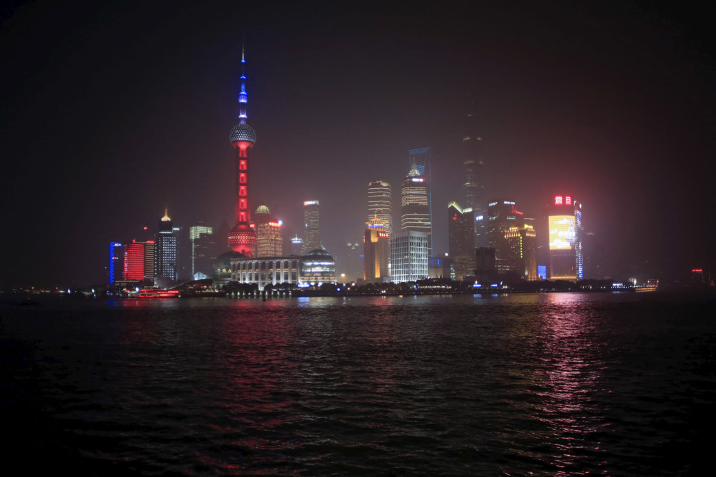 Oriental Pearl TV Tower is lit up in blue, white and red, the colors of the French flag, following the Paris attacks, in Shanghai