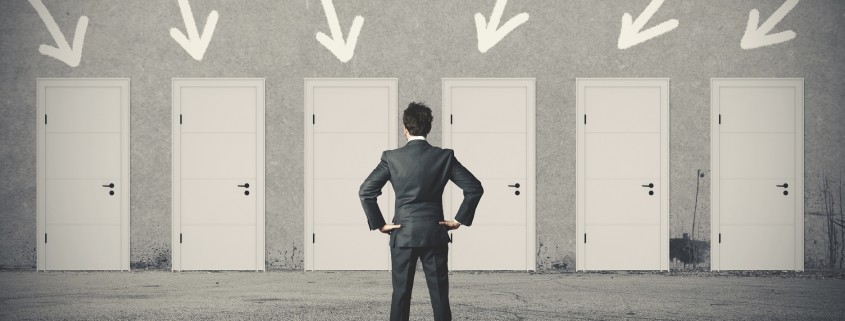 Businessman choosing the right door